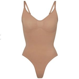 SKIMS Seamless Sculpt Thong Bodysuit in Sienna